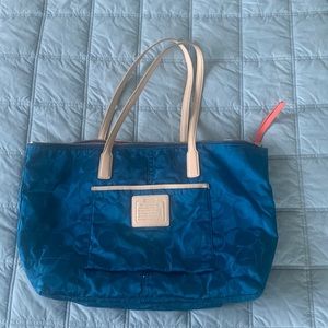 Teal & red-orange Coach tote.